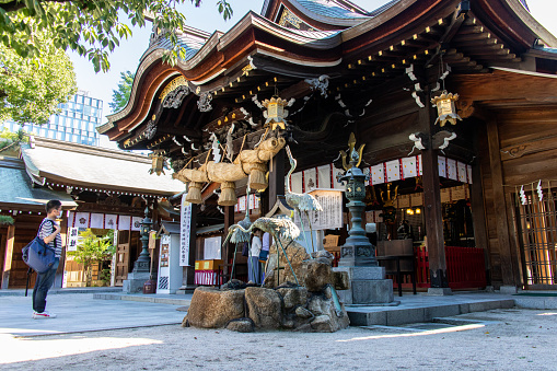 Hakata, Fukuoka / Japan - Aug 15 2020 : The main shrine of Kushida-jinja (Kushida Shrine), a Shinto shrine founded in 757 that dedicated to Amaterasu & Susanoo, in sunny day.