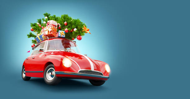 Red Santa's car with gift boxes and christmas tree on the top stock photo