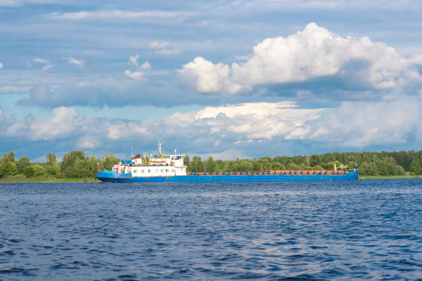 istock Shipping boat floating on river or lake calm view 1280738429