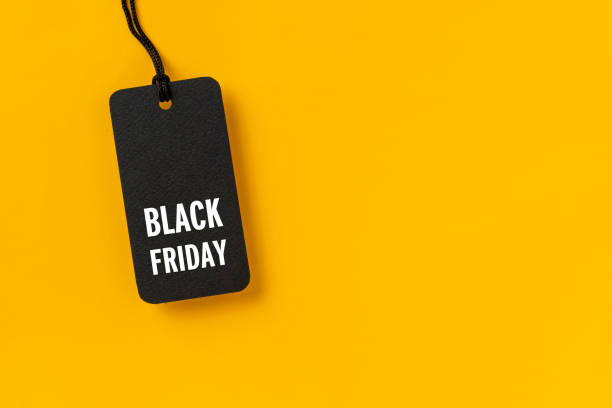 istock Sale tag with Black Friday written on yellow background 1280739326
