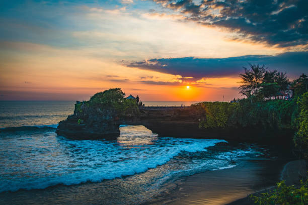 Bali Water Temple at sunset Beautiful Tanah Lot Hindu temple in Bali at sunset tanah lot temple bali indonesia stock pictures, royalty-free photos & images