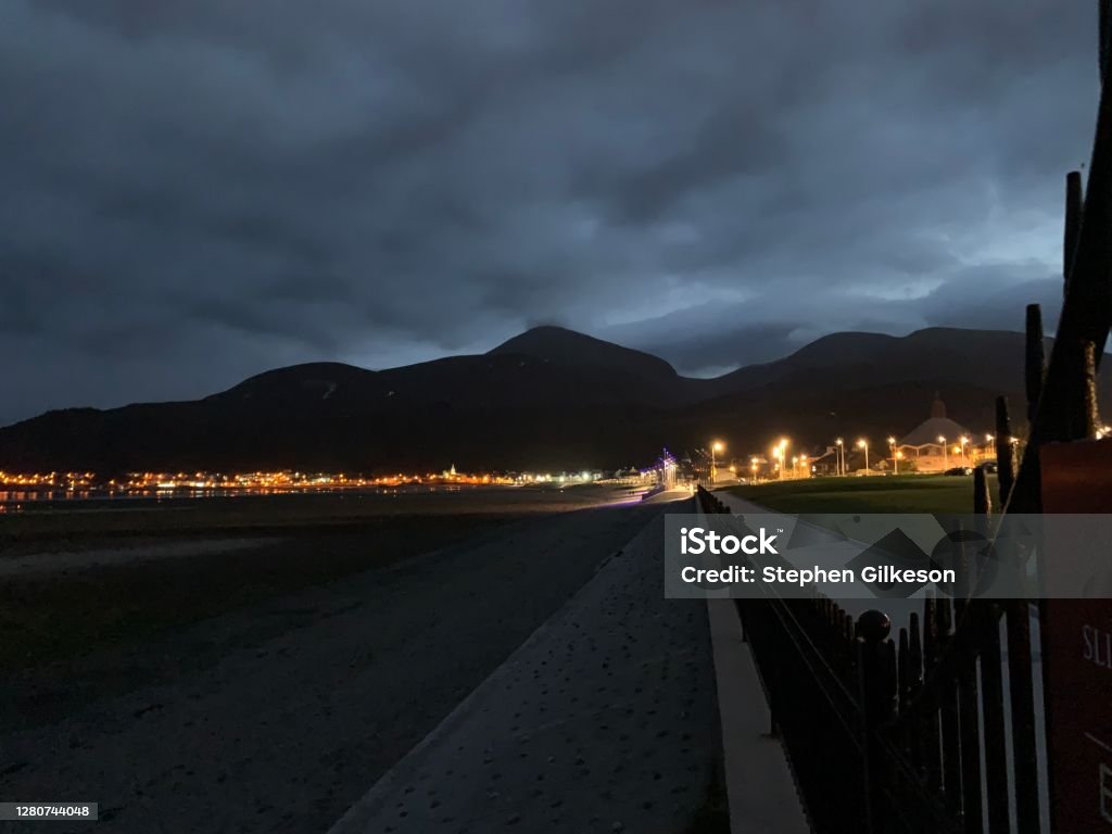 Newcastle County Down at Night View of Newcastle Town at Night Mourne Mountains in Background Beach Stock Photo