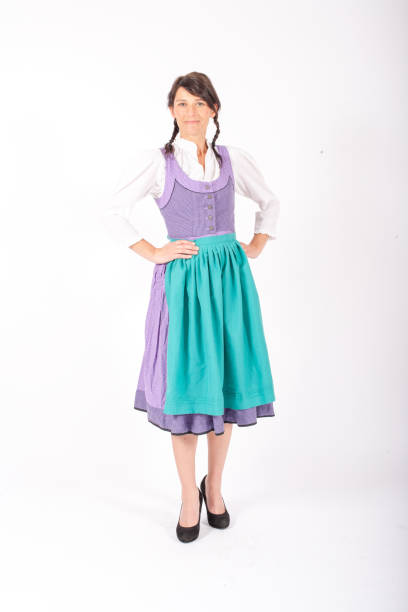 istock young brunette woman in a bavarian dirndl standing on white background 1280744089