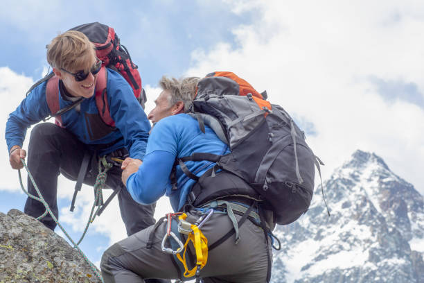 istock Mountaineers climb up mountain ridge 1280745666