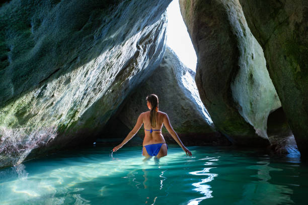 istock Bikini woman in the cave at the Baths, Virgin Gorda 1280746314
