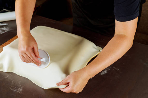 istock Woman making cake with fondant for party. 1280751545