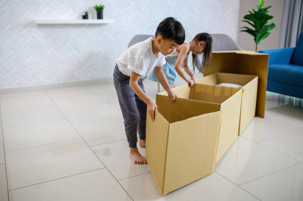 istock Two Asian little children having fun play in a cardboard ship 1280752925