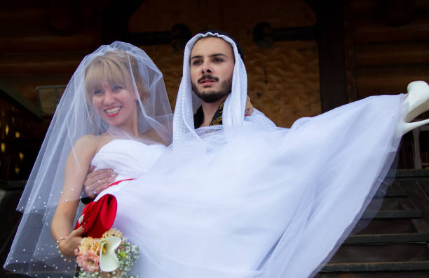 Russia. Moscow, August 27, 2017. Imailovsky park.Parade of brides. Groom Arab and European bride. International couples.