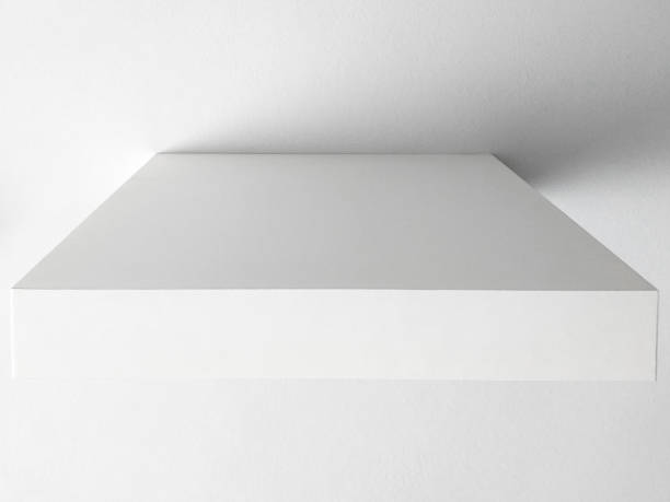 istock Close up. Front view of white wall shelf. Elegant and minimalist design. Empty floating shelf on white wall. Interior decoration background. 1280755239