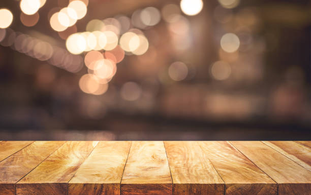 istock Wood table top (bar) with blur light bokeh in dark night cafe,restaurant background 1280756617