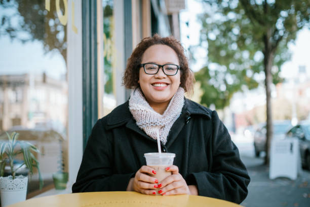 istock Woman Working on Laptop Outside Coffee Shop 1280757077