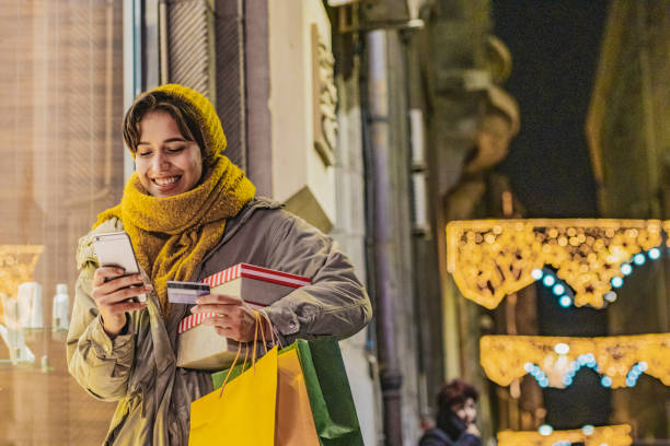 istock Young woman shopping for Christmas 1280760971