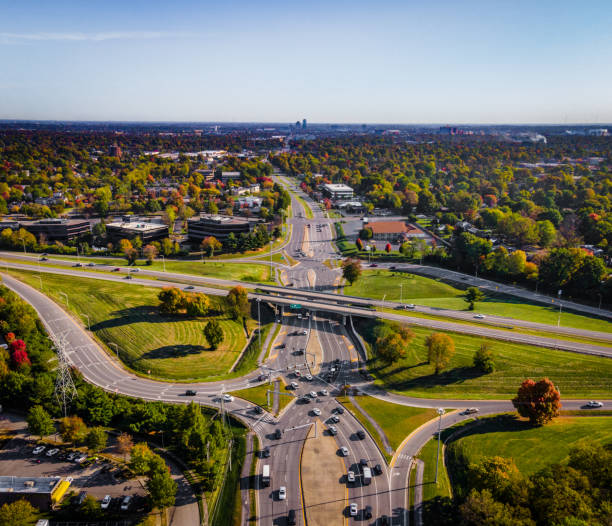 istock Eight snapped intercrossing traffic on Diverging Diamond Interchange on Harrodsburg road in Lexington, KY USA with distant view of the city downtown area 1280762312