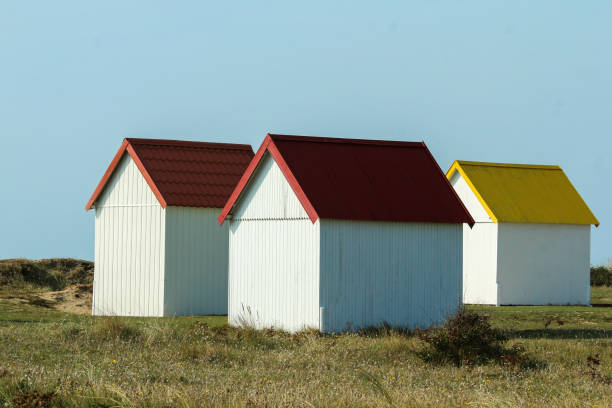 istock The tiny white beach cottages with colorful roofs 1280762807