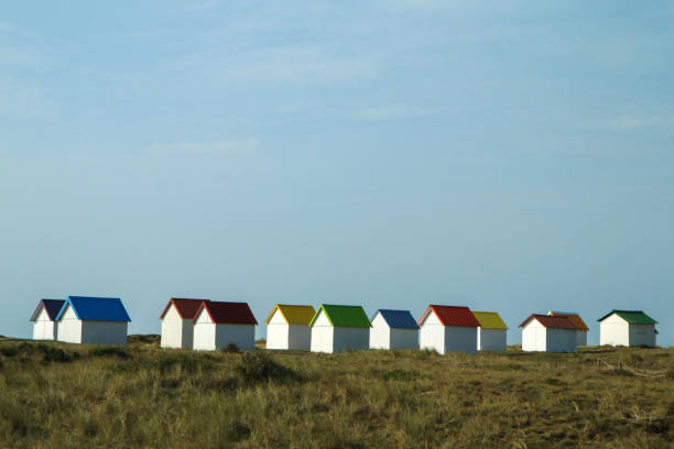 istock The tiny white beach cottages with colorful roofs 1280763485