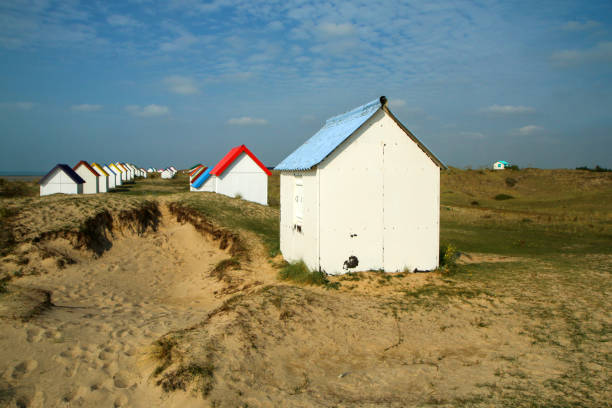 istock The tiny white beach cottages with colorful roofs 1280763520