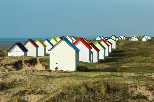 istock The tiny white beach cottages with colorful roofs 1280763537