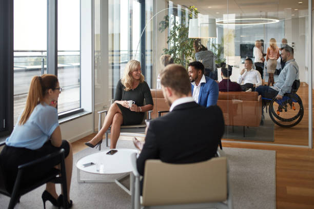 istock Groups of Executives Conversing in Office Reception Rooms 1280766979
