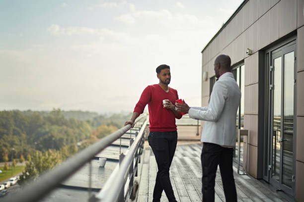 istock Black Male Executives Taking a Break to Converse on Terrace 1280766981