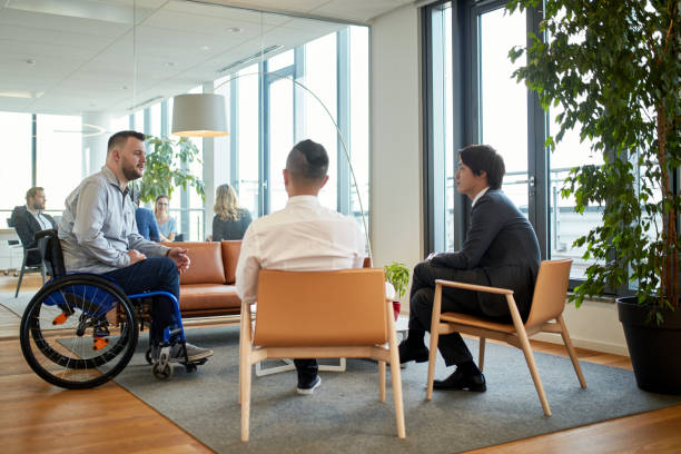 istock Young Businessmen Talking in Modern Office Reception Room 1280766985