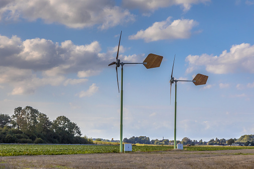 Two small windturbines in open agricutural landscape Groningen, Netherlands