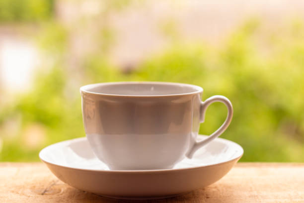istock Tea Cup on a wooden windowsill with sunlight. Beautiful natural background. 1280768474