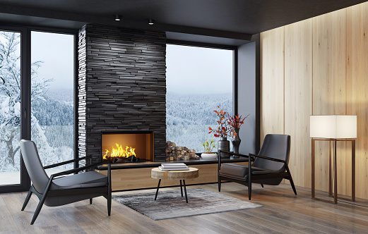 Country villa luxurious living room with fireplace.
Black stone slate chimney.
Stylish and comfortable sitting area with a modern leather armchair.
3d rendering.