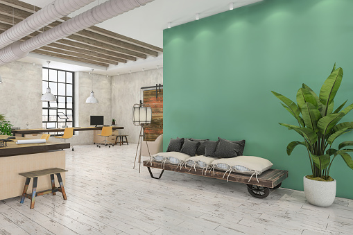 Modern furnished office interior with concrete blank wall for copy space and sofa