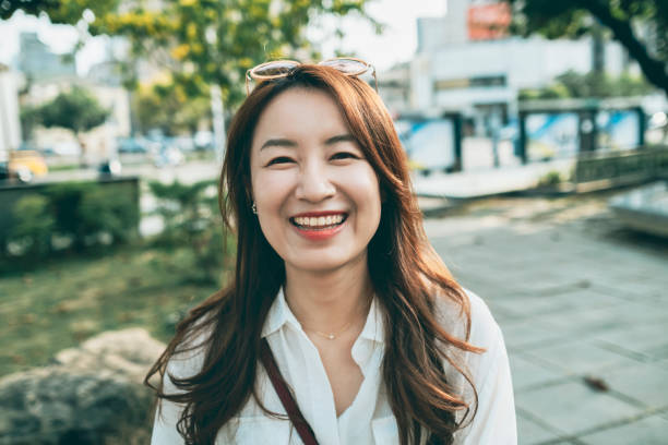 istock Asian Woman Smile To Camera 1280773605