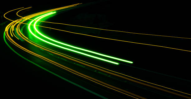 istock orange car lights at night. long exposure 1280775669