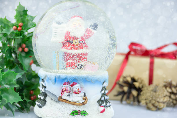 istock Christmas snow globe with Santa Claus inside with Christmas decoration 1280777610