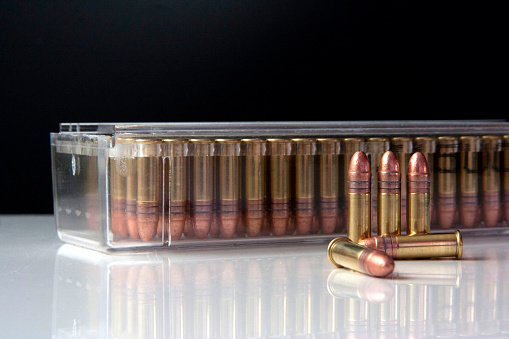 Closeup of a box of .22 high velocity weapon ammunition with bullets in the front. Ammo.