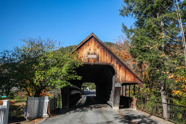 Woodstock Middle bridge build in 1969 near Central Street with morning autumn lights and blue sky Woodstock, VT, USA - October 9, 2020: Woodstock Middle bridge build in 1969 near Central Street with morning autumn lights and blue sky woodstock stock pictures, royalty-free photos & images