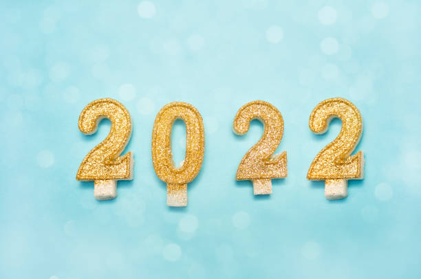 istock Happy new year 2022 celebration, glitter numbers on blue background 1280779086