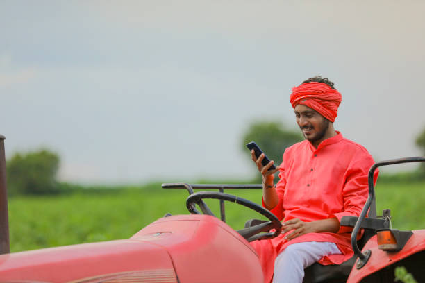 istock young indian farmer talking on smartphone 1280782328