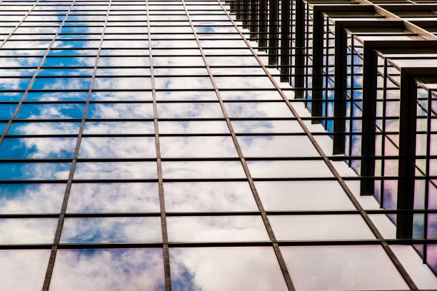 sunset reflection in the windows of the building. part of the building