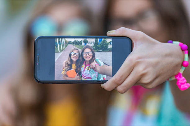 istock Playful girls taking a selfie and having fun 1280784889