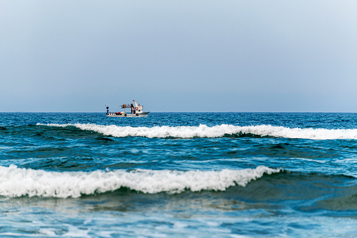 Fishing boat waves and on the sea in Turkey.