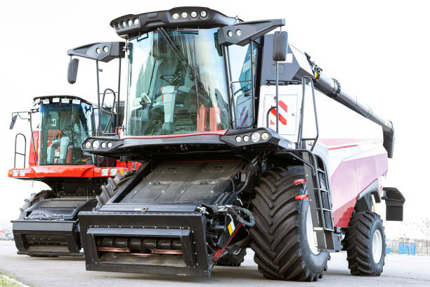 istock Two combines for harvesting grain. Large agricultural tractor on a white background. 1280788997