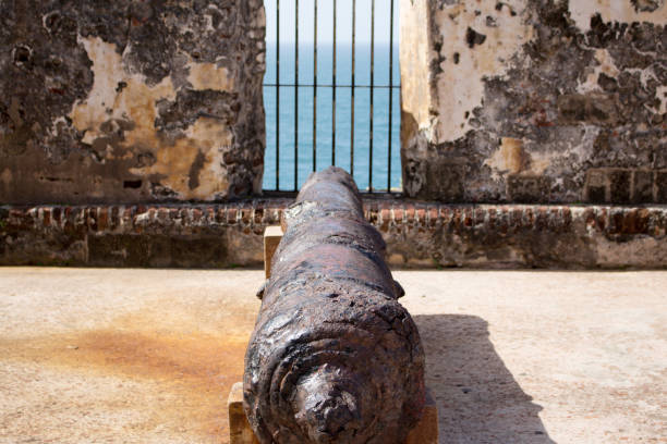 istock Historic rustic canon pointing out at sea in San Juan 1280789021