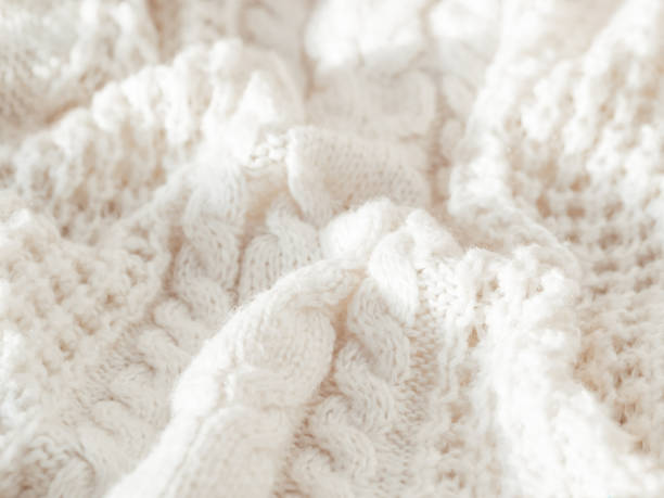 istock Hand made cable-knit sweater sweater. Texture of warm knitted fabric with pattern. White crumpled cardigan. Cozy autumn outfit for snuggle weather. 1280792175