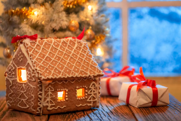 istock Unique gingerbread cottage, presents and Christmas tree 1280792469