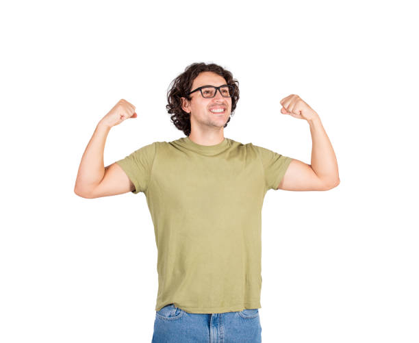 istock Confident young man flexing muscles imagine superpower. Nerd guy wears eyeglasses shows his strength, positive face expression looking aside. Personal development, power and motivation concept. 1280793372