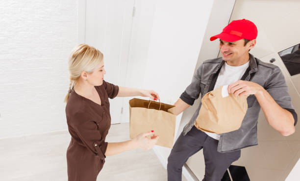istock Driver Delivering Online Grocery Shopping Order 1280795626