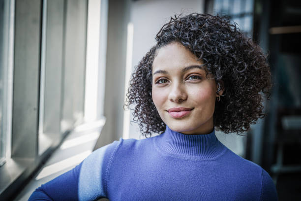 istock Young Mixed Race Woman by the Window 1280797563