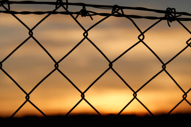 istock Sunset behind the fence that runs through El Pardo in Madrid. Spain 1280800941