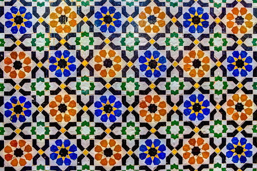 Close up of mosaic and plaster architectural details on buildings in Fez Morocco