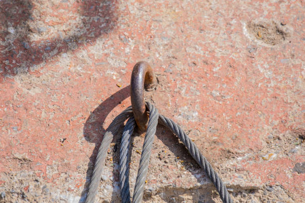 iron ring and a steel rope, old concrete block