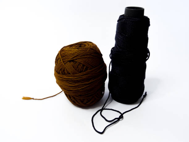 istock black and brown knitting yarn on a white background 1280804473