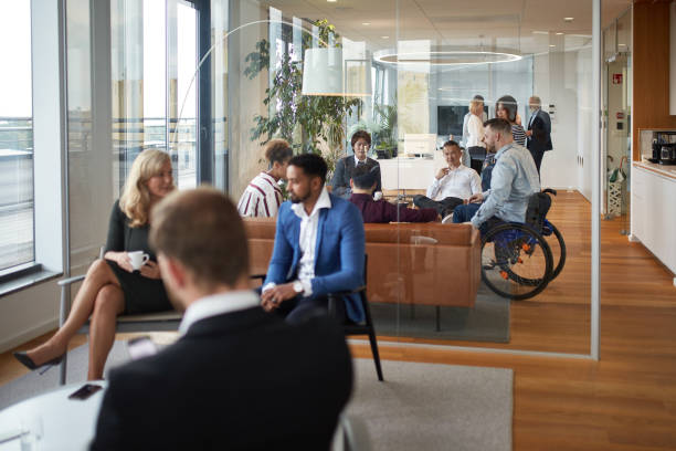 istock Groups of Businesspeople Talking in Multiple Reception Rooms 1280805411